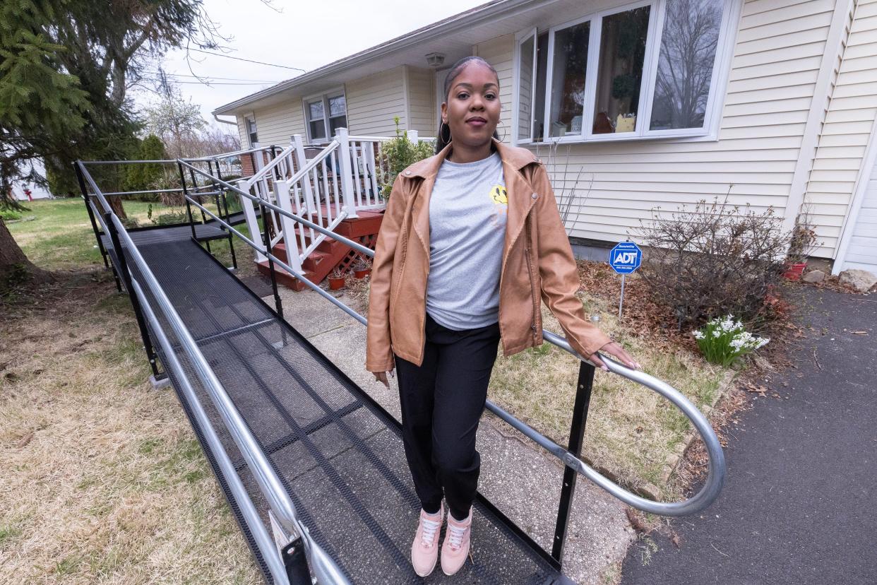 Dominique Medler stands on the ramp that was installed for her mother Elizabeth by Amramp New Jersey.