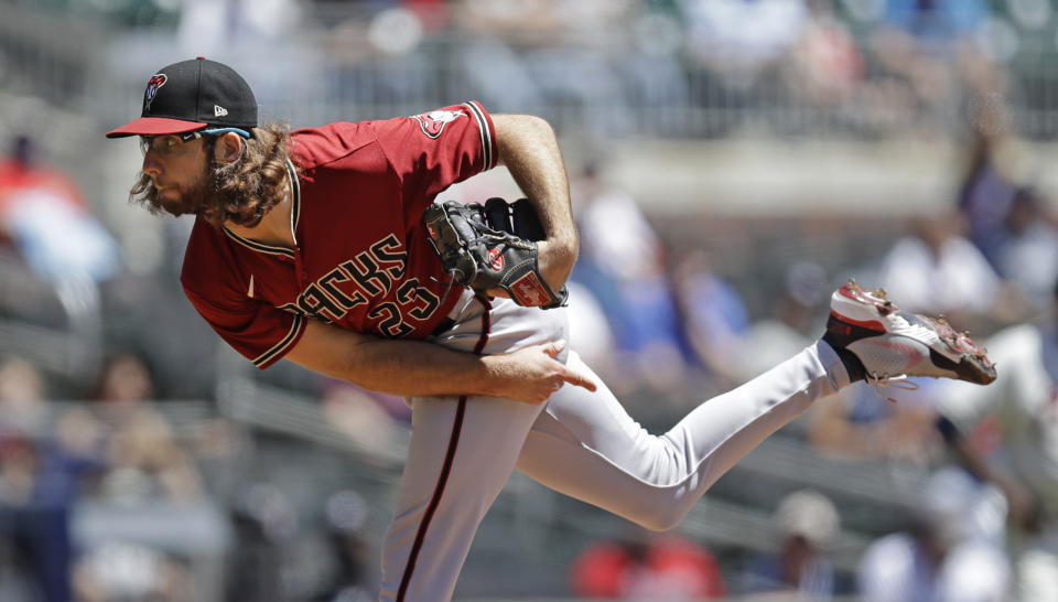 Arizona Diamondbacks pitcher Zac Gallen works against the Atlanta Braves in the first inning of the first baseball game of a double header, Sunday, April 25, 2021, in Atlanta. (AP Photo/Ben Margot)