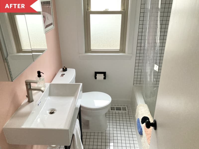 After: Bathroom with white square tiles and pink wall