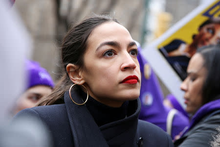 FILE PHOTO: Rep. Alexandria Ocasio-Cortez (D-NY) looks on during a march organised by the Women's March Alliance in the Manhattan borough of New York City, U.S., January 19, 2019. REUTERS/Caitlin Ochs/File Photo