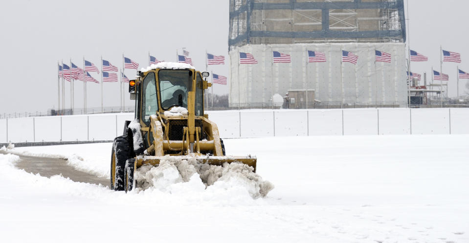 The area around the Washington Monument in Washington is clears of snow, Monday, March 17, 2014. (AP Photo/Susan Walsh)