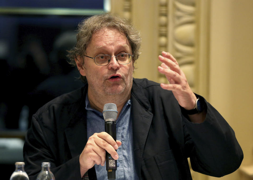 Chairman of the consumer protection association Peter Kolba speakes during a press conference of a class action lawsuit against the Tirol regional authorities for failing in their public health duties, related to the virus outbreak in the ski-resort of Ischgl, seen as a key location from which the virus spread across Europe, in Vienna, Austria, Wednesday, Sept. 23, 2020. (AP Photo/Ronald Zak)