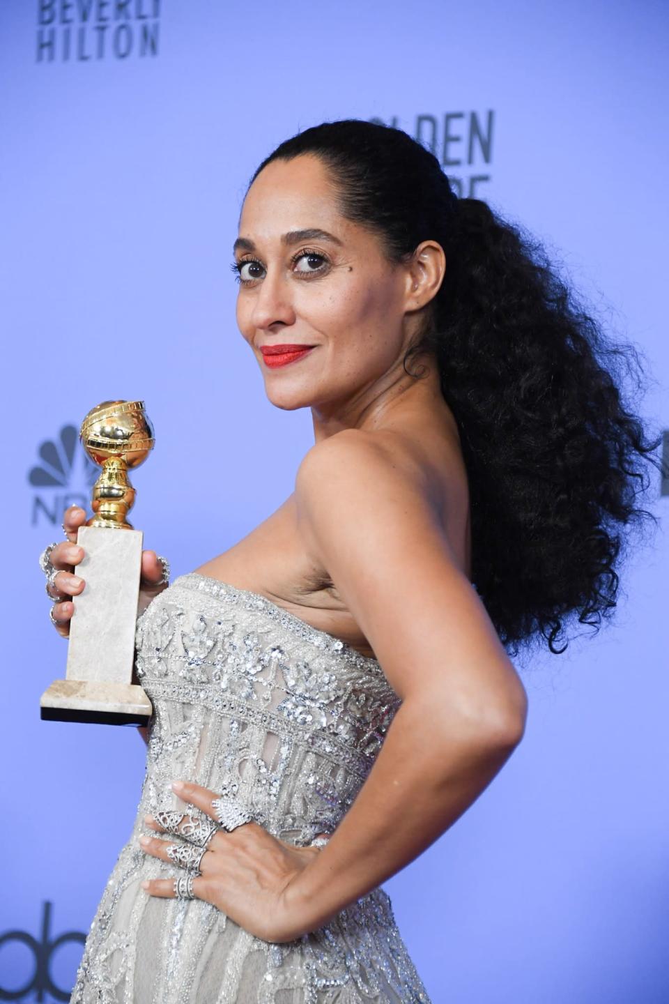 <p>Golden Globe Award winner Tracee Ellis Ross shined in the spotlight with her textured low ponytail, fresh skin (using Kiehl’s skincare products!), and red-orange lip. To recreate this bold lip color, mix <a rel="nofollow noopener" href="http://www.lorealparisusa.com/products/makeup/lip-color/lipstick/infallible-lip-paints.aspx?&shade=Orange-Envy-322" target="_blank" data-ylk="slk:L'Oréal Paris Infallible Paint Lip" class="link ">L'Oréal Paris Infallible Paint Lip</a> ($10) in #322 and #324 and brush it onto your lips. (Photo: Getty Images) </p>