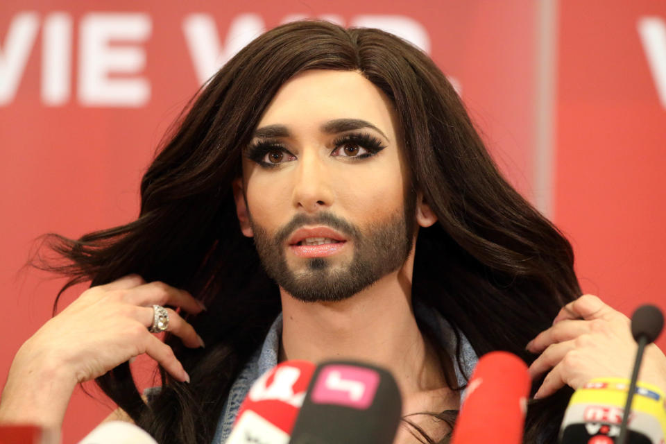 Austrian singer Conchita Wurst attends a press conference in Vienna, Austria Sunday May 11, 2014. Bearded drag queen Conchita Wurst has made a triumphant return to Austria after winning the Eurovision Song Contest in Copenhagen Saturday, in what the country's president called a victory for tolerance in Europe. (AP Photo/Ronald Zak)