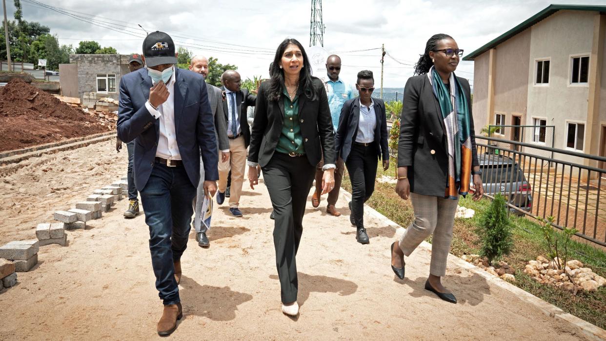 Then-Home Secretary Suella Braverman tours a building site on the outskirts of Kigali during her visit to Rwanda in March 2023