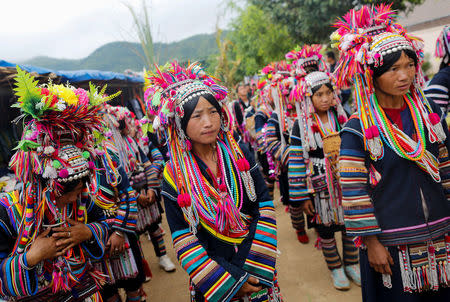 Ethnic Akha women march during a festival in a village outside Pansang, Wa territory in north east Myanmar October 3, 2016. Picture taken October 3, 2016. REUTERS/Soe Zeya Tun