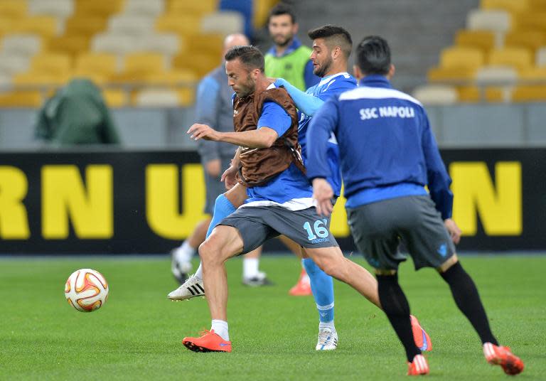 Napoli's Giandomenico Mesto (L) and Manolo Gabbiadini (2nd L) take part in a training session on May 13, 2015