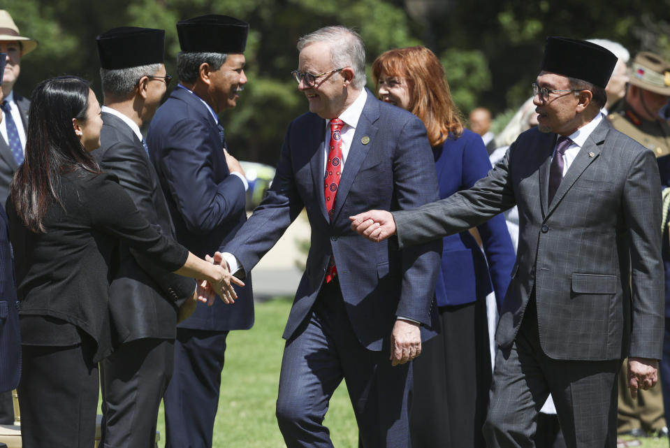 The Prime Minister of Malaysia Anwar Ibrahim, right, introduces his official party to Australian Prime Minister Anthony Albanese during a ceremonial welcome ceremony at Government House ahead of the ASEAN-Australia Special Summit in Melbourne, Australia, Monday, March 4, 2024.An increasingly assertive China and a humanitarian crisis in Myanmar are likely to be high on the agenda when Southeast Asian leaders meet in Australia for a rare summit March 4-6. (AP Photo/Hamish Blair)