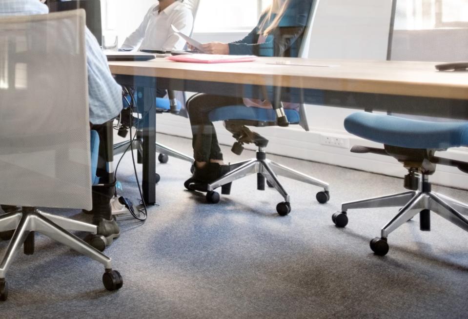 people sitting around a conference table