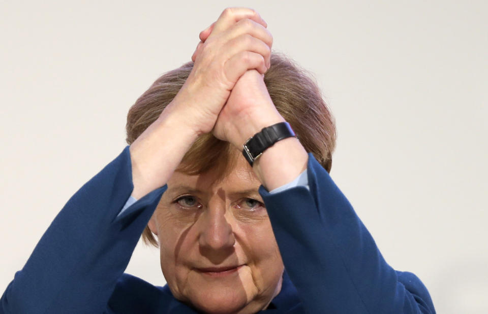 Christian Democratic Union, CDU, chairwoman and German Chancellor Angela Merkel receives the applause after her speech during a party convention of the Christian Democratic Party CDU in Hamburg, Germany, Friday, Dec. 7, 2018. 1001 delegates are electing a successor of German Chancellor Angela Merkel who doesn't run for party chairmanship after more than 18 years at the helm of the party. (AP Photo/Markus Schreiber)