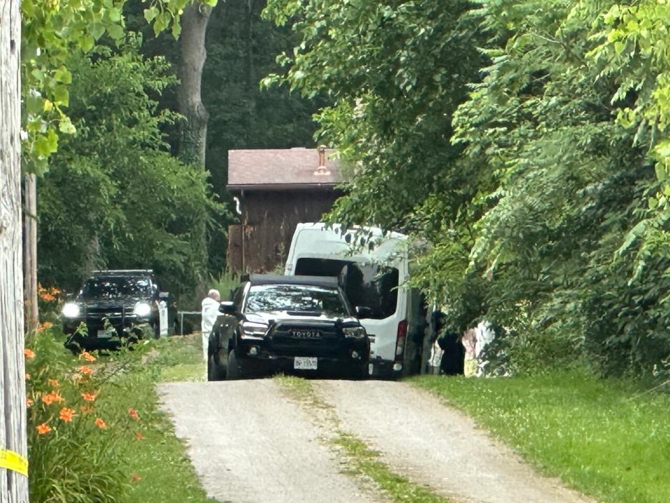 Forensic investigators at the Walsh family home, 1200 County Road 13 near Harrow, on June 20, 2024.