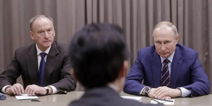 Russian Security Council Secretary Nikolai Patrushev and Russia's President Vladimir Putin during a meeting with the Secretary-General of the Japanese National Security Council.