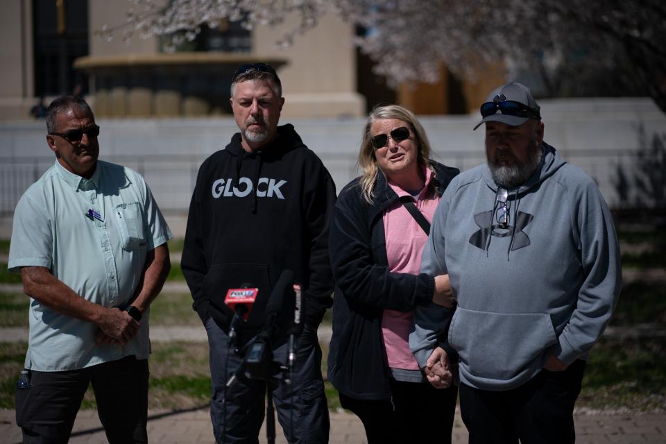 Michelle Strain Whiteid, second right, and her husband, Chris Whiteid, speak to the media during a press conference to update the public about the disappearance of University of Missouri student Riley Strain at Public Square Park in Nashville, Tenn., Tuesday, March 19, 2024. Also pictured are David Flagg, United Cajun Navy, left, and Riley's dad, Ryan Gilbert.