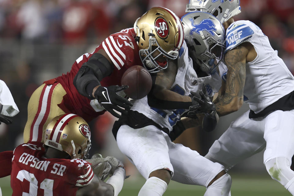 FILE - Detroit Lions running back Jahmyr Gibbs, middle, fumbles the ball against San Francisco 49ers linebacker Dre Greenlaw (57) and safety Tashaun Gipson Sr., bottom left, during the second half of the NFC Championship NFL football game in Santa Clara, Calif., Sunday, Jan. 28, 2024. The 49ers recovered the ball. The 49ers trailed 24-7 at halftime, but they’d pulled within a touchdown when Gibbs fumbled on the first play of Detroit’s ensuing drive. Just over two minutes later, the game was tied, and the Lions wouldn’t lead again. (AP Photo/Jed Jacobsohn, File)