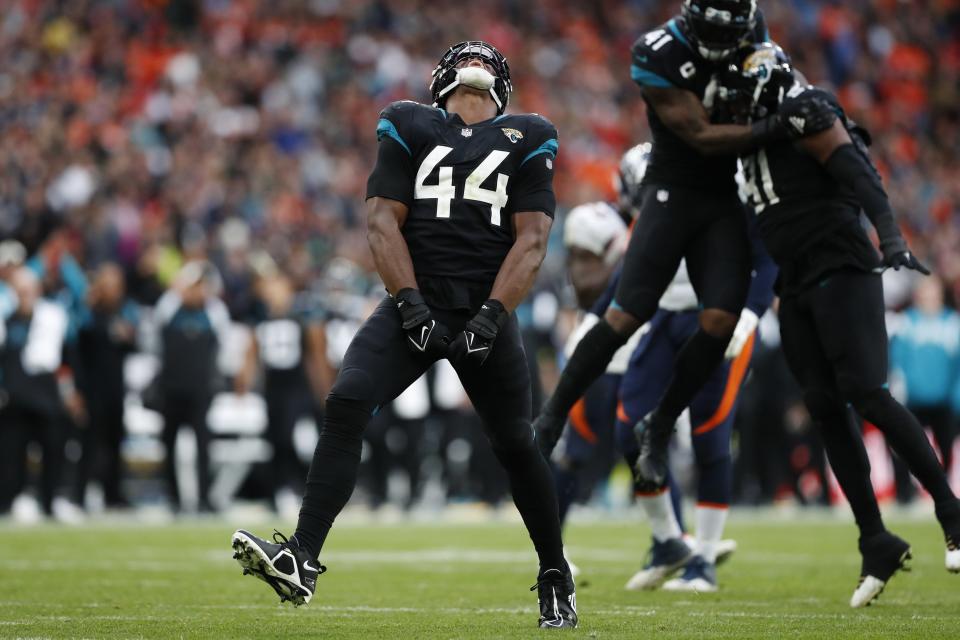 Jacksonville Jaguars linebacker Travon Walker (44) celebrates after a play during an NFL football game against the Denver Broncos at Wembley Stadium in London, Sunday, Oct. 30, 2022. (AP Photo/Steve Luciano)