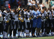 <p>Members of the Los Angeles Chargers link arms during the national anthem before an NFL football game against the Kansas City Chiefs, Sunday, Sept. 24, 2017, in Carson, Calif. (AP Photo/Jae C. Hong) </p>