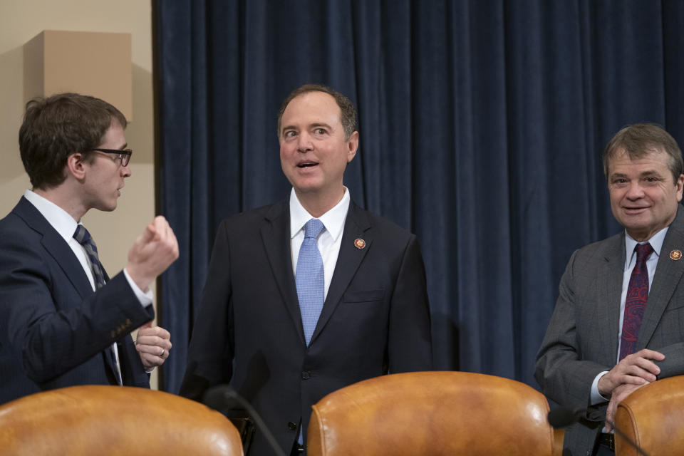 House Intelligence Committee Chairman Adam Schiff, D-Calif., center, joined at right by Rep. Mike Quigley, D-Ill., opens a hearing on politically motivated fake videos and manipulated media, on Capitol Hill in Washington, Thursday, June 13, 2019. (AP Photo/J. Scott Applewhite)