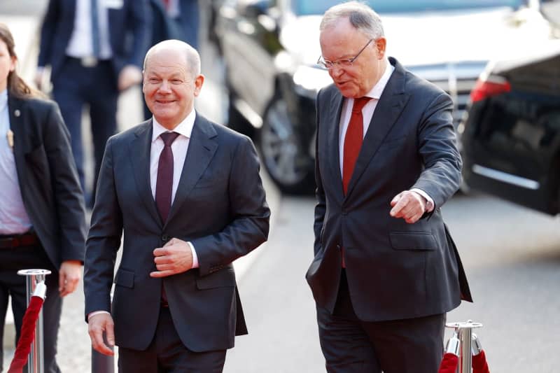 Germany's Chancellor Olaf Scholz (L) and Stephan Weil, Minister President of Lower Saxony, attend the opening ceremony of the Hannover Messe in the Hannover Congress Centrum (HCC). Michael Matthey/dpa