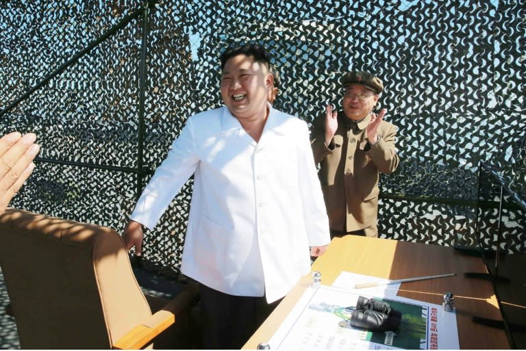 North Korean leader Kim Jong-Un (C) inspects the ground jet test of a new type high-power engine of a carrier rocket, at the Sohae Space Centre, in September 2016