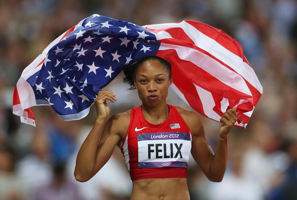 Allyson Felix of the United States celebrates after winning gold in the Women's 200m Final on Day 12 of the London 2012 Olympic Games at Olympic Stadium on August 8, 2012 in London, England. (Photo by Quinn Rooney/Getty Images)