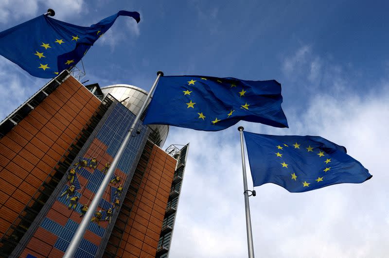 FILE PHOTO: European Union flags flutter outside the EU Commission headquarters in Brussels, Belgium