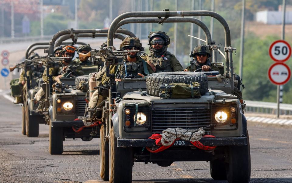 Israeli soldiers patrol on a street in Sderot, near the border with Gaza, in Israel