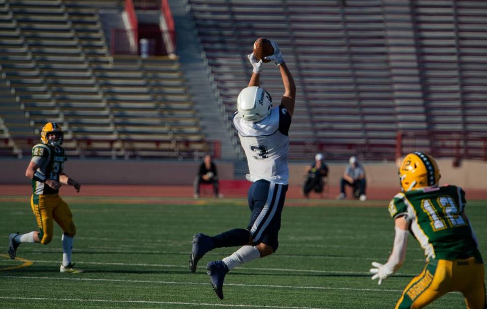 Rosemont Wolverines cornerback Kegan Hill intercepts a pass against the Argonaut Mustangs during the third quarter of the CIF Sac-Joaquin Section Division VI championship game on Saturday, Nov. 27, 2021, at Hughes Stadium in Sacramento. The Mustangs won 31-20.