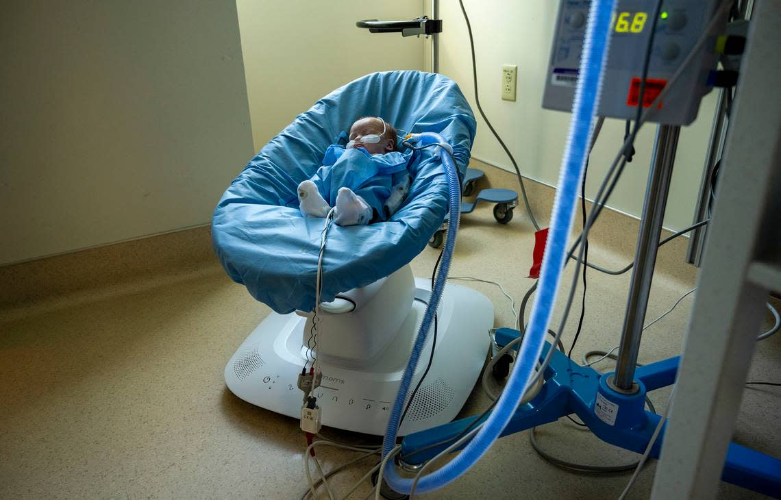 A newborn named Casey sleeps in a Mama Roos sleeper at the neonatal unit at Mercy Hospital in Citrus Heights on Nov. 22. The NICU at Mercy Hospital is asking Book of Dreams for more of the multimotion baby swings to provide comfort to newborns.