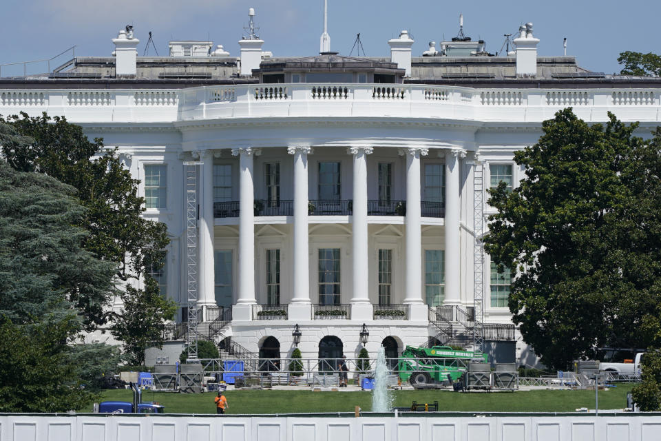 FILE - In this Aug. 18, 2020, file photo workers construct staging on the South Lawn of the White House in Washington. Donald Trump is expected to speak to the Republican National Committee convention from the South Lawn of the White House. (AP Photo/Patrick Semansky, File)