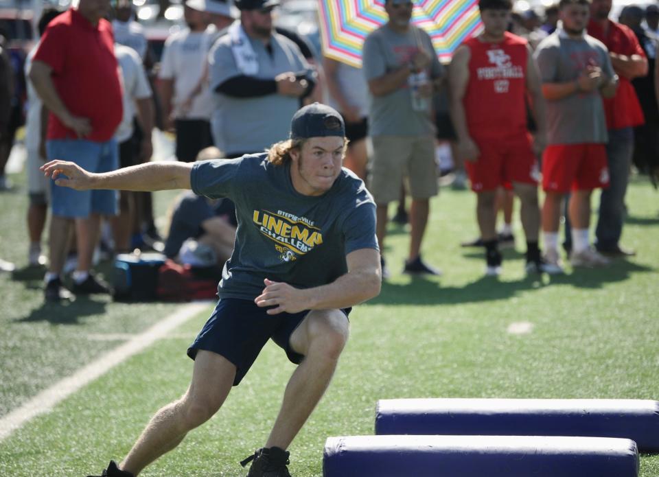 An athlete from Stephenville competes at the lineman event Saturday.