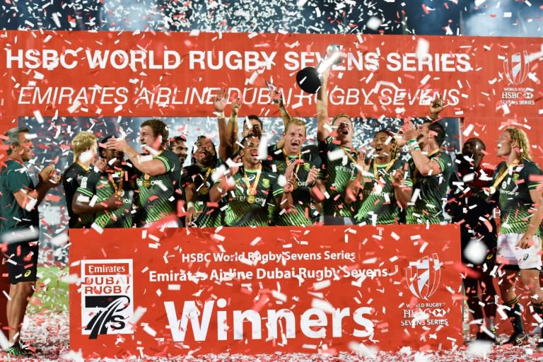 South Africa's players celebrate winning against Fiji in the World Rugby Men's Seven Series on December 3, 2016 in Dubai