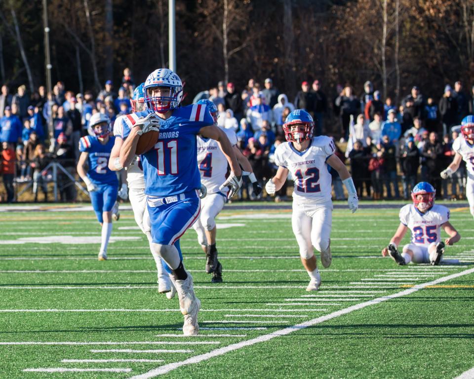 Winnacunnet's Dom Gould runs down the sideline during last fall's Division I championship game against Londonderrry. Gould will represent the Warriors on Team East in Saturday's 10th annual Children's Hospital at Dartmouth-Hancock (CHaD) East-West All-Star Football Game.