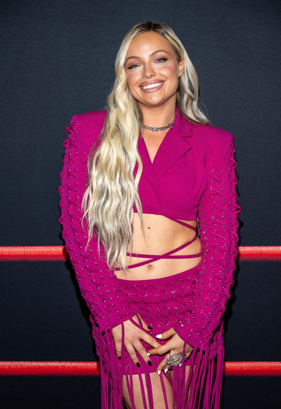 Liv Morgan in a pick crop top jacket and pink skirt at "The Iron Claw" premiere