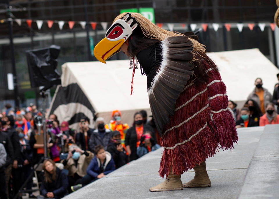 A member of the Coastal Wolf Pack dancers performs for the crowd on Canada's first National Day for Truth and Reconciliation, honouring the lost children and survivors of Indigenous residential schools, their families and communities, at the former Vancouver Art Gallery North Plaza in Vancouver, British Columbia, Canada September 30, 2021. REUTERS/Amy Romer