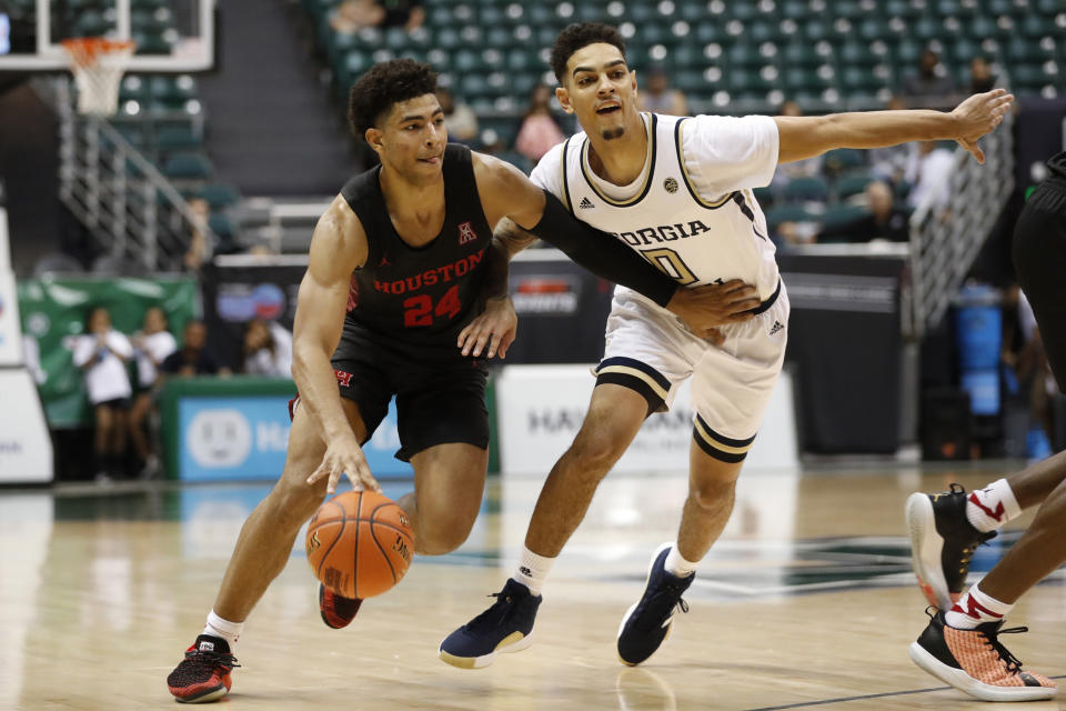 Houston guard Quentin Grimes (24) slips past Georgia Tech guard Michael Devoe (0) during the second half of an NCAA college basketball game Monday, Dec. 23, 2019, in Honolulu. (AP Photo/Marco Garcia)