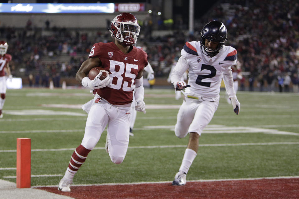 Washington State wide receiver Calvin Jackson Jr. (85) runs for a touchdown in front of Arizona cornerback Lorenzo Burns (2) during the first half of an NCAA college football game in Pullman, Wash., Saturday, Nov. 17, 2018. (AP Photo/Young Kwak)