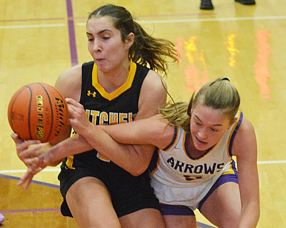 Mitchell's Sawyer Stoebner (left) and Watertown's Emery Thury tussle during their Eastern South Dakota Conference girls basketball game on Tuesday, Dec. 12, 2023 in the Watertown Civic Arena. Mitchell won 56-33.