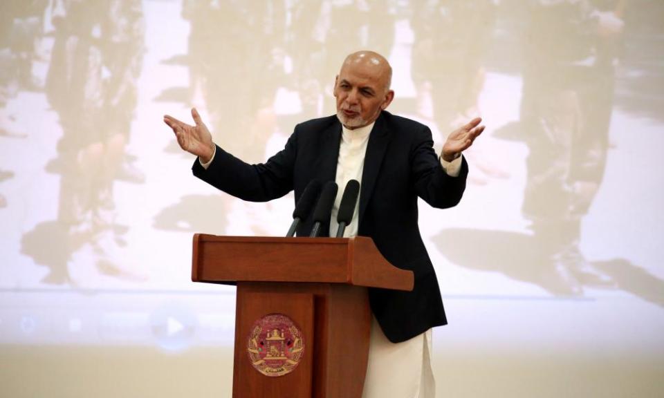 The Afghanistan president, Ashraf Ghani, addresses Afghan security forces in Kabul on Monday. He was excluded from and opposed to the US-Taliban deal.