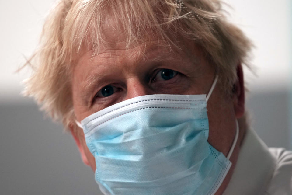 Britain's Prime Minister Boris Johnson wears a face mask during a visit to Leeds General Infirmary in Leeds, northern England on October 2, 2021. (Photo by Christopher Furlong / POOL / AFP) (Photo by CHRISTOPHER FURLONG/POOL/AFP via Getty Images)