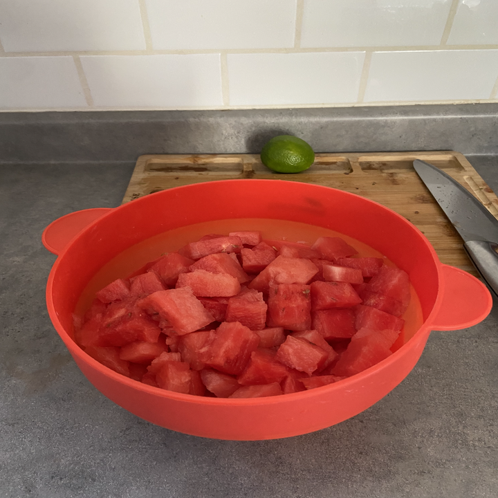 Watermelon chunks in a bowl on a countertop