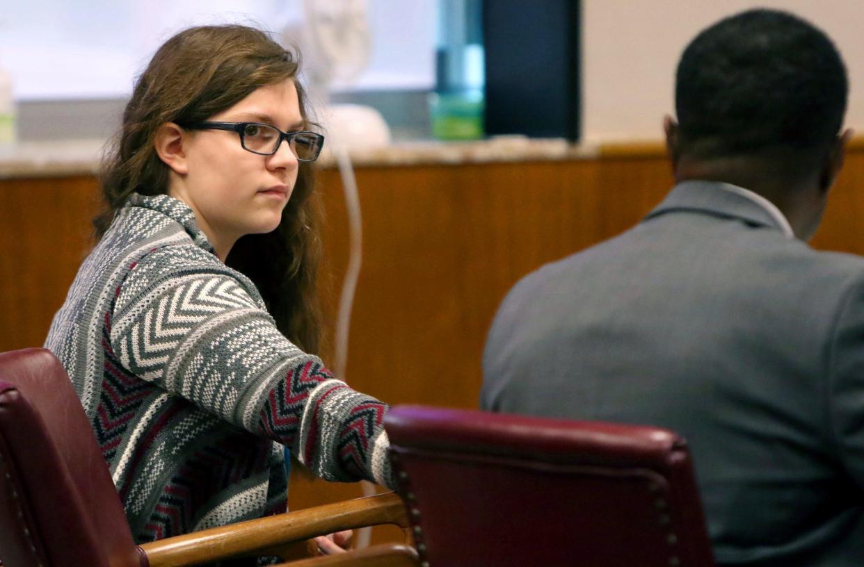 Anissa Weier passes a note to her attorney, Joseph Smith, during closing arguments in her case before Waukesha County Circuit Judge Michael Bohren on Sept. 15, 2017. A jury found her not guilty by reason of mental disease or defect. Weier, who was released from Winnebago Mental Health Institute in 2021, to live with her father while still under state supervision, will no longer have to wear a GPS device under terms of her conditional release.