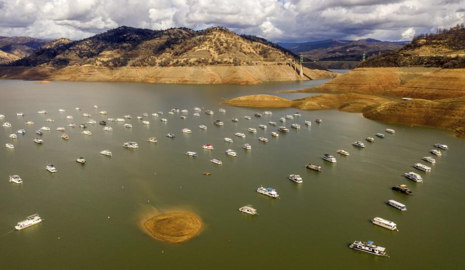 Houseboats float on Lake Oroville in Oroville, Calif.