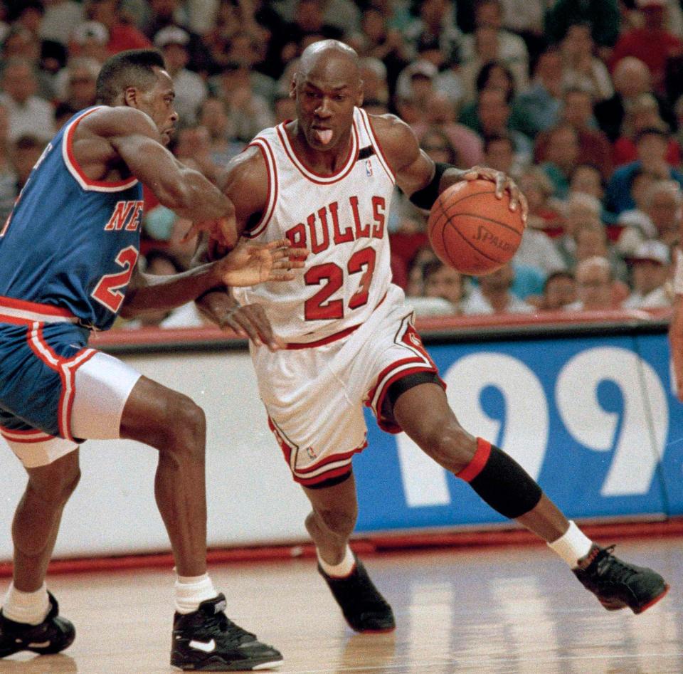 In this May 17, 1992 file photo, Chicago Bulls&#39; Michael Jordan drives on New York Knicks&#39; Gerald Wilkins during Game 7 of the Eastern Conference semifinals in Chicago.