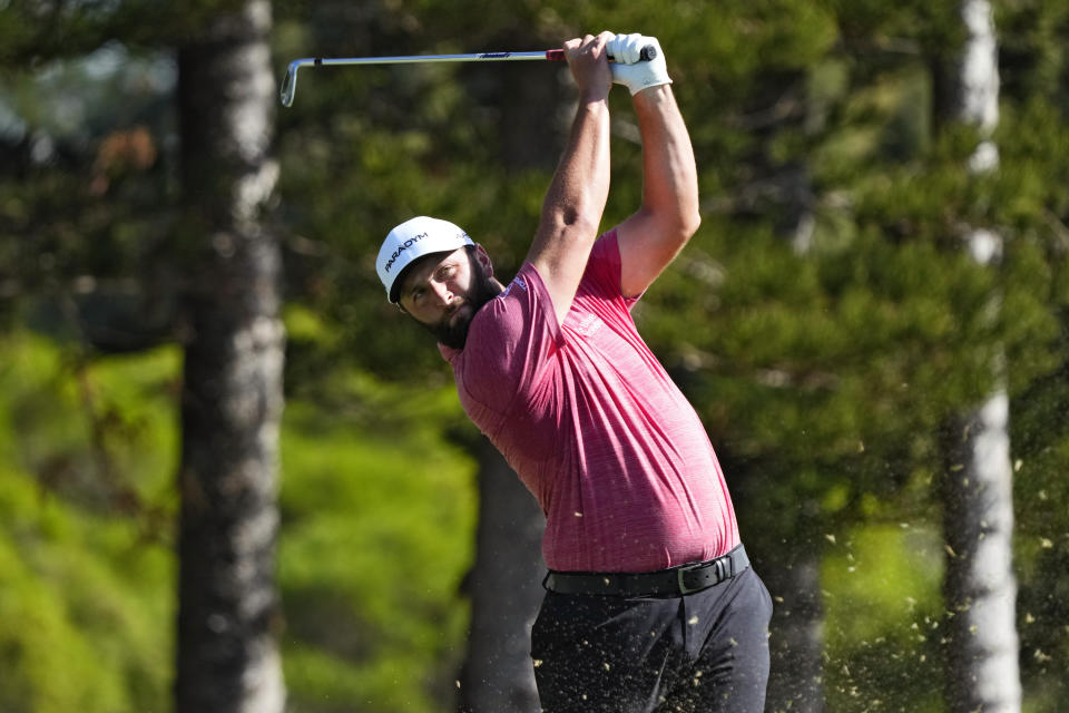 Jon Rahm, of Spain, plays his shot from the second tee during the final round of the Tournament of Champions golf event, Sunday, Jan. 8, 2023, at Kapalua Plantation Course in Kapalua, Hawaii. (AP Photo/Matt York)
