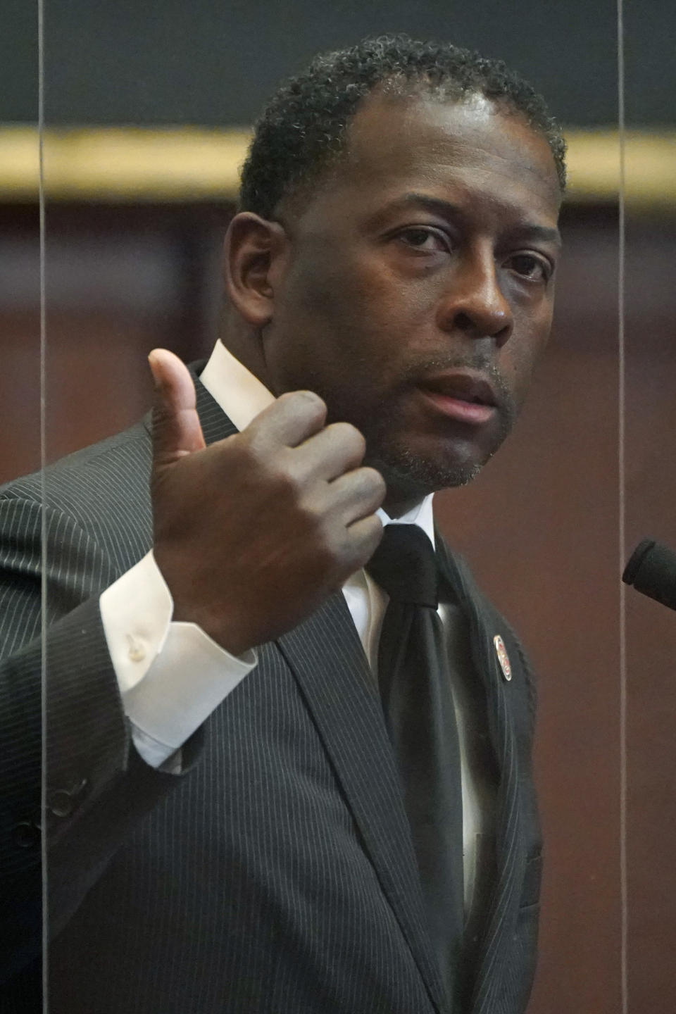 State Rep. Christopher Bell, D-Jackson, argues against legislation that would limit how race can be taught in schools and universities, Thursday, March 3, 2022, in the House Chamber at the Mississippi Capitol in Jackson, Miss. Black lawmakers raised concerns that if the bill becomes law, it would stifle honest lessons about racism. The white lawmaker who explained the bill said repeatedly that it would not prevent the teaching of history, but would only prevent teaching that any person is superior or inferior because of race, sex or national origin. (AP Photo/Rogelio V. Solis)