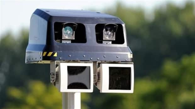 The province is looking into tools like photo radar, as seen here. The devices detect the speed of moving vehicles, take pictures of the licence plate and send a ticket if the driver is going too fast.  (Philippe Huguen/Getty Images - image credit)