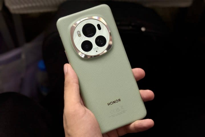 Someone holding the Honor Magic 6 Pro, showing the back of the phone.