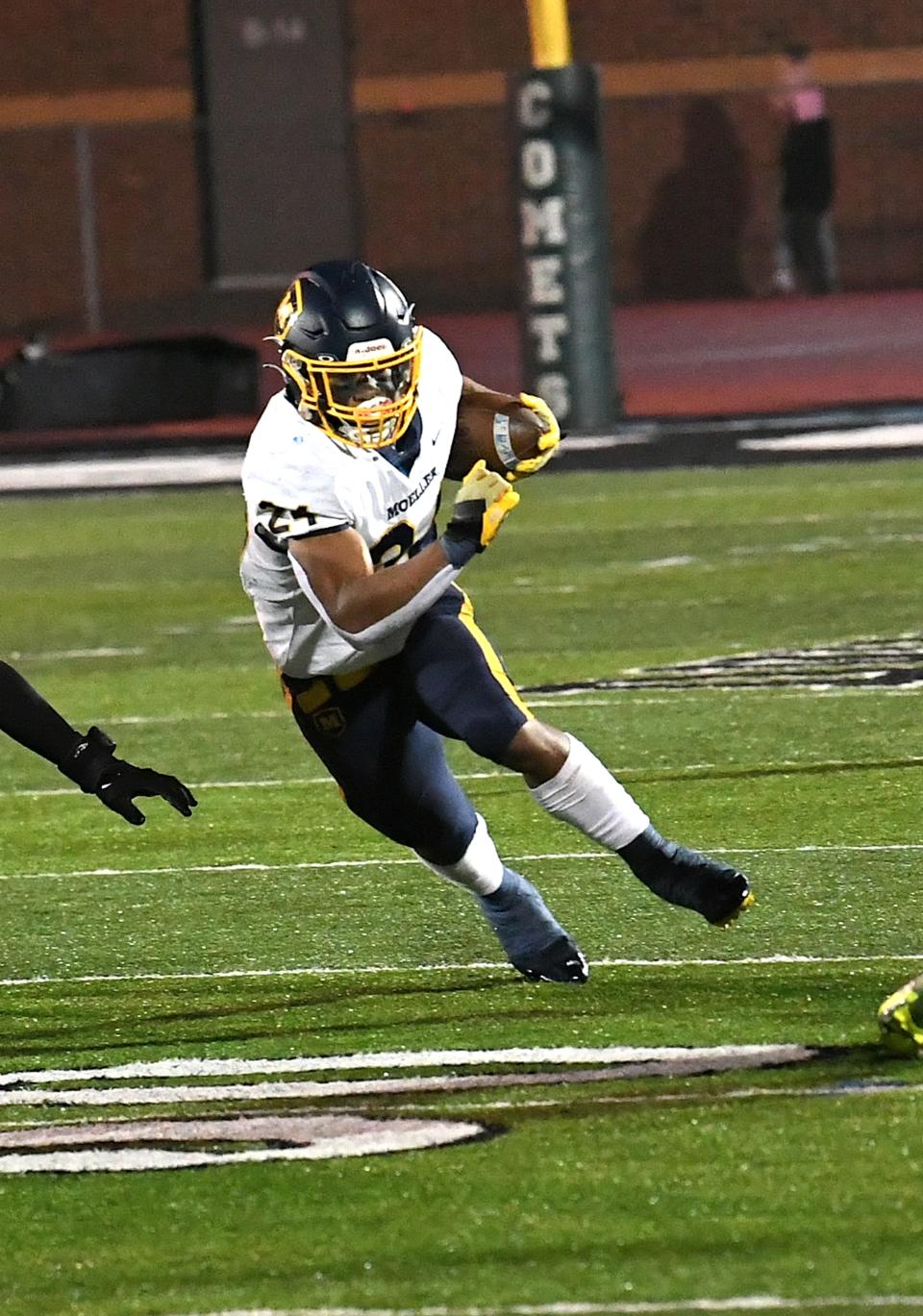 Moeller's Jordan Marshall powers ahead for a Crusaders' first down at the OHSAA Division I, Region 4 football championship at Mason, Ohio, Nov. 17, 2023.