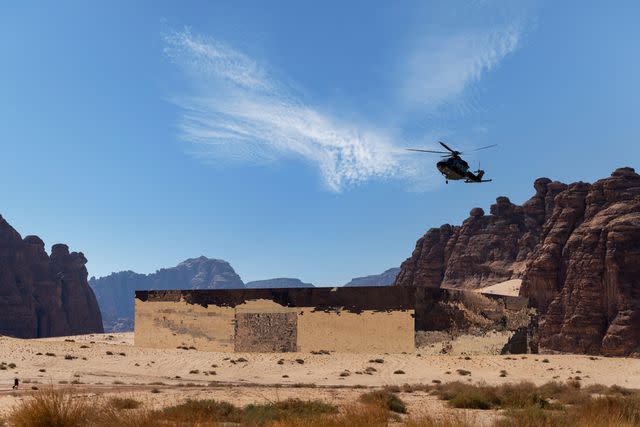 <p>almozinisaleh/Getty Images</p> Helicopter hovering over Maraya Concert Hall in Alula, Saudi Arabia.