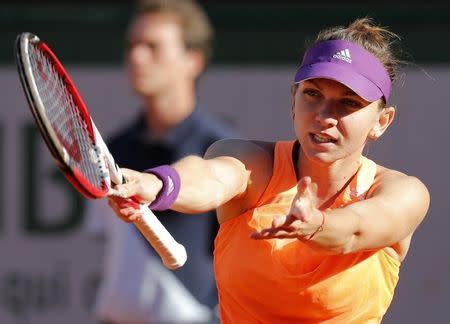 Simona Halep of Romania reacts during her women's semi-final match against Andrea Petkovic of Germany at the French Open tennis tournament at the Roland Garros stadium in Paris June 5, 2014. REUTERS/Jean-Paul Pelissier